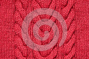 Red knitted texture, craft. Background