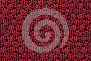 Red knitted wool fabric texture background