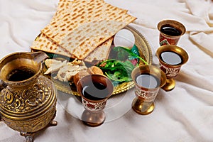 Red kosher wine four glasses of matzah or matza Passover Haggadah