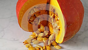 Red kuri squash, seed and pumpkin oil close up