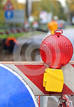 Red lamp to signal roadworks and road works