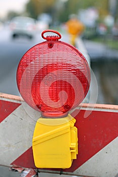 Red lamp to signal roadworks and road works in progress