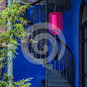 Red Lantern, Blue Wall, Bamboo and a Spiral Staircase