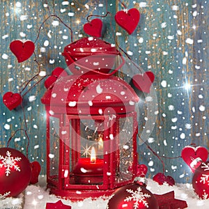 Red lantern with candlelights and shnowflakes - christmas atmosphere