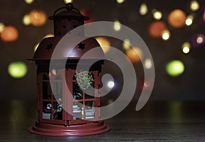 Red Lantern decorate by Christmas ornament with colorful Christmas light