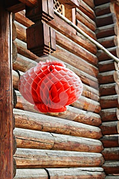 Red lantern outside a cabin