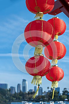 Red lanterns on display against a deep blue sky