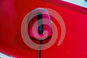 Red laptop with red mouse