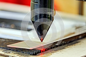 Red laser on cutting machine
