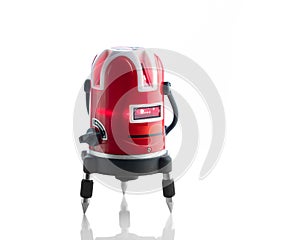 Red laser level tool on white