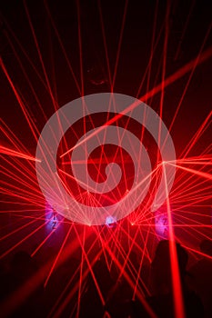 Red laser lights in a nightclub