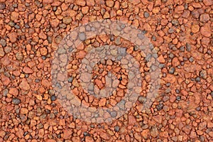 Red laterite gravel texture for background