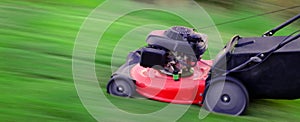 Red Lawn Mower in Lush Green Grass Mowing Lawn