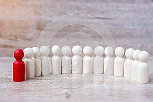Red leader businessman with crowd of wooden men. leadership, business, team, teamwork and Human resource management concept