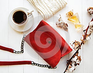 Red leather bag and cotton flowers