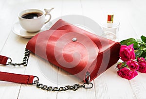 Red leather bag and flowers