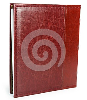 Red leather book on wite backround