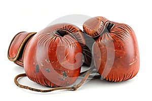 Red leather boxing gloves isolated on white background. Concept of boxing equipment, combat sports gear, training