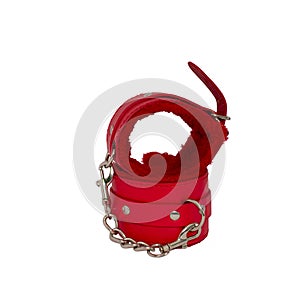 Red leather handcuffs in white background.