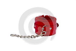 Red leather handcuffs in white background.