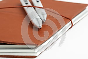 Red Leather Journal Cover With Two Ballpoint Pens