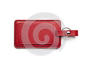 Red leather luggage tag isolated on white background
