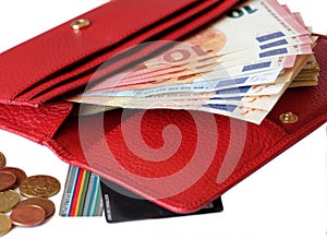 Red leather purse with money