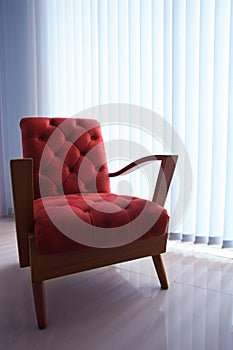 Red leather sofa in living room with curtain and l