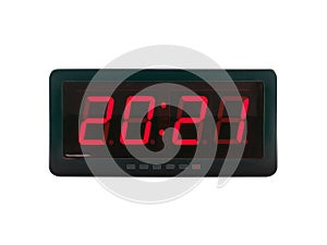 Red led light illumination numbers 2021 on black digital electric alarm clock display isolated on white background