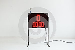 Red led light illumination numbers on black digital electric display isolated on white background