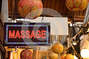 Red LED massage signage hanging at the Chatuchak weekend market,Bangkok