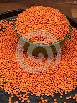 Red lentils in a green ceramic bowl