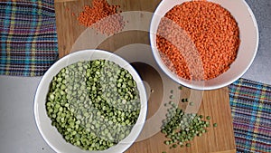 Red lentils and green peas. High protein legumes,beans and lentils for vegetarians. Circular rotation.