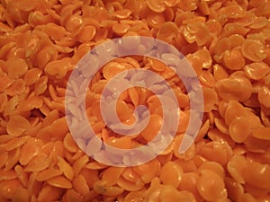 Red Lentils soaked in water. Closeup veiw. photo