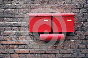Red letter boxes on old brick wall Horizontal image.
