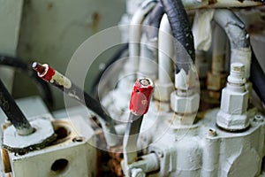 Red lever on industrial machine