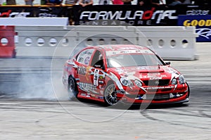 Red Lexus drifting during a competition