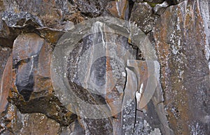 Red Lichen Growth on Lava Flow Rock Walls