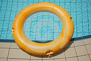 Red life buoy in swimming pool.. Help and support concept.