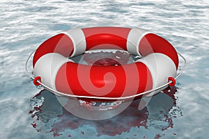 Red life buoy in the water