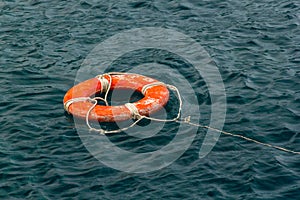 Red life buoy in the water