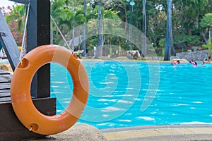 red lifebuoy near a public swimming pool