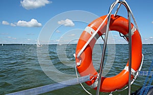 Red lifebuoy on yacht