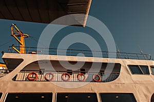 red lifebuoys on moored vessel against