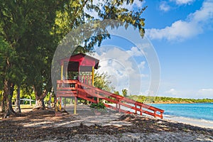 Red Lifeguard hut along shore of Seven Sea beach in tropical Fajardo Puerto Rico