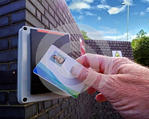 Red light on an electronic card reader, showing a man being refused access to a secure location