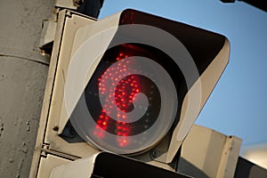 Red light on an old, dirty traffic light