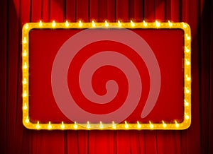 Red light sign with gold frame on theatre or cinema curtain