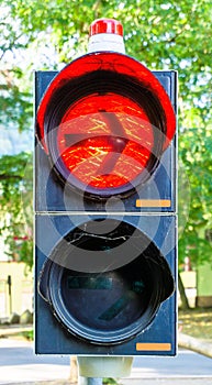 Red light at a traffic light with an arrow prohibiting vehicles wishing to turn right from continuing their journey