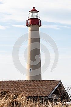Red Lighthouse on the Beach with Blue Sky Portrait